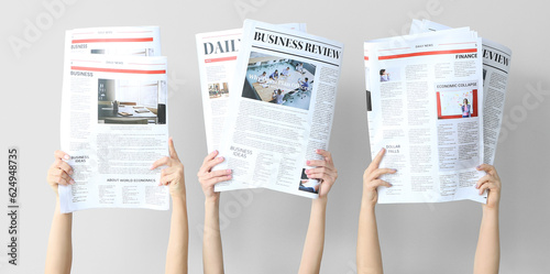 Female hands with newspaper...