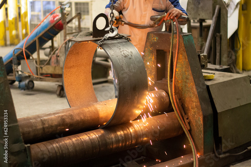 worker cutting steel