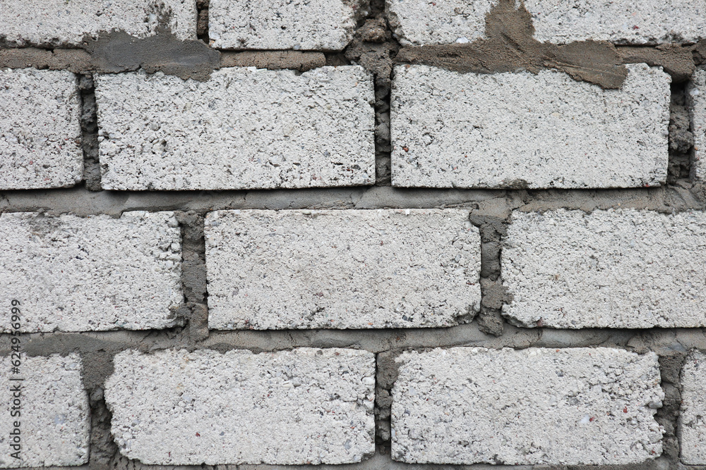 Fototapeta premium grey wall with open bricks concept 