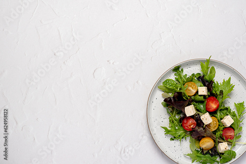Blank food photography of feta salad; vegetable; tomato; onion; lettuce; spinach, rocket, mizuna, cheese; leaf; organic; ingredients; slice; vitamin; vegetarian; diet
