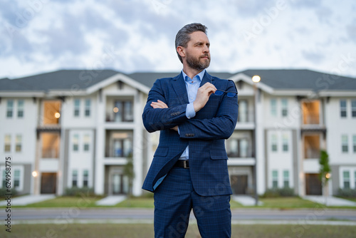 man broker outdoor. image of man broker. man broker at the house. man broker in the suit