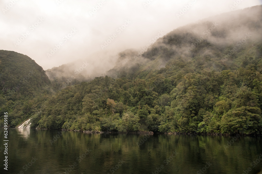 Sailing in Mystical moody weather in heavy rain and stormy conditions on Doubtful Sound Sailing in Mystical moody weather in heavy rain and stormy conditions on Doubtful Sound