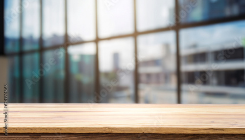 Wood table top on blur glass window wall building background. For montage product display or design key visual layout background.