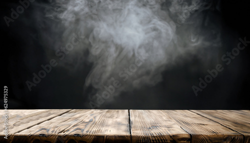 Dark empty wooden table with smoke float up on dark wall background. Free space for your decoration.
