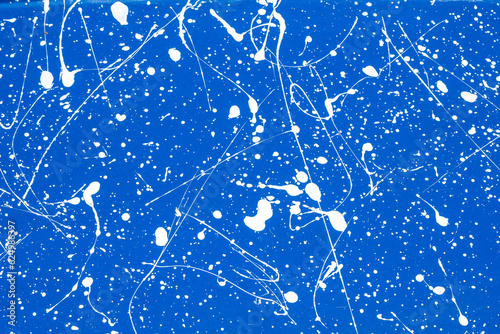 background:  white paint random pattern on solid blue flat surface photo