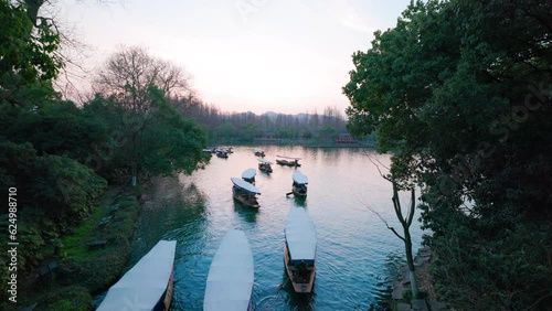 Bridge view of boats on Xihu river, Xihu District, Hangzhou China