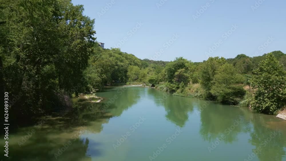 Flying upstream low angle above Guadalupe River. Flying upstream low angle above Guadalupe River.