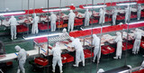 Group of workers working in a line in pork industry plant