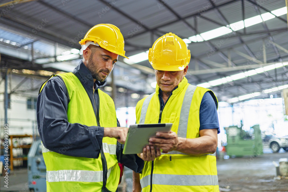 worker and engineer using tablet computer for inspection and checking production process on factory station worker and engineer using tablet computer for inspection and checking production process on factory station