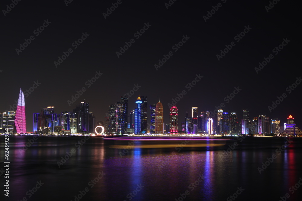 Boats and the skyline view of Doha, Qatar at the night Boats and the skyline view of Doha, Qatar at the night