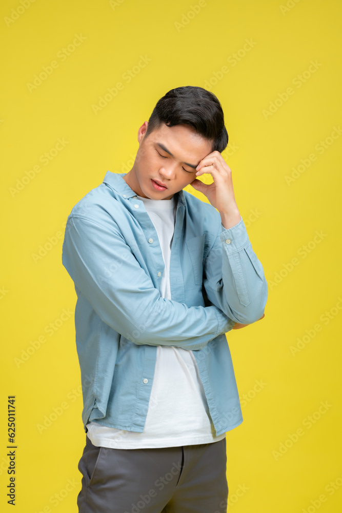 man in depression with hand on forehead, isolated over yellow man in depression with hand on forehead, isolated over yellow