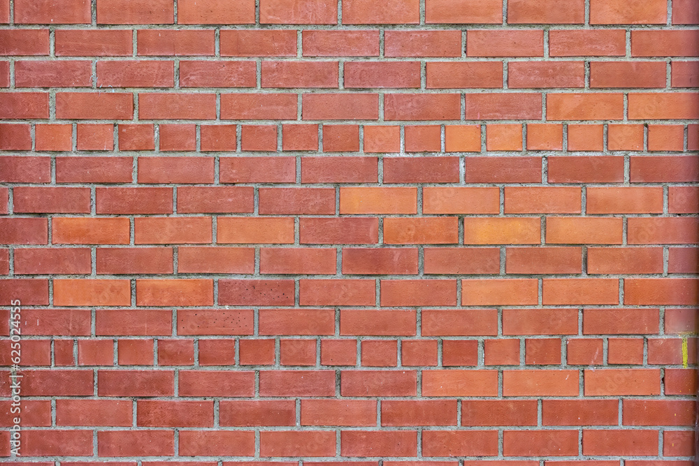 Obraz premium Red brick wall texture for background usage as a backdrop design.