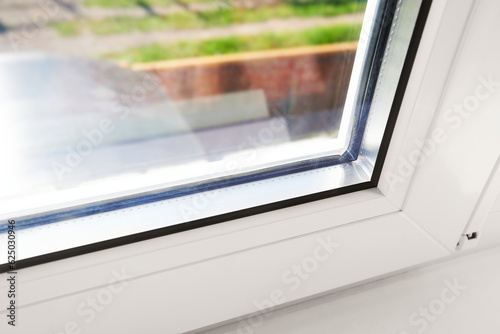 Bottom detail of window frame of PVC profiles. Window frame glass. Energy efficient, safety window glazed. Rubber seal gasket.