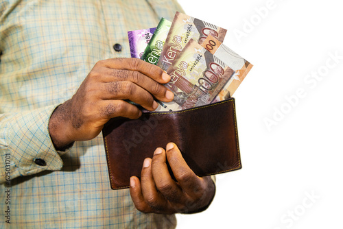 Cuadro en lienzo Black person Holding brown wallet
With Kenyan shilling notes, hand removing mone