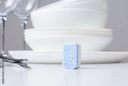 Dishwasher detergent tablet and clean dishes