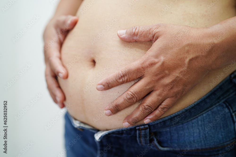 Asian woman show fat belly big size overweight and obesity at office. Asian woman show fat belly big size overweight and obesity at office.