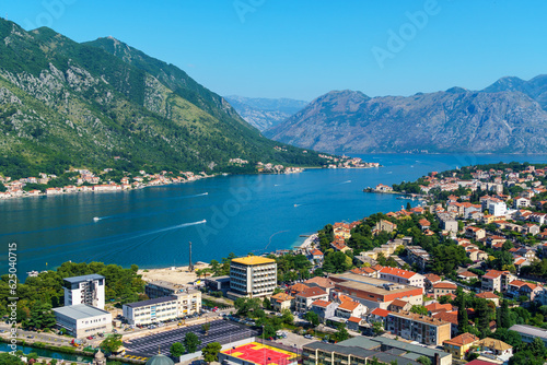 view of the old town of Kotor in Montenegro and the coast of the Bay of Kotor, the sea and medieval European architecture, city streets, red tiled roofs, the concept of traveling across the Balkans