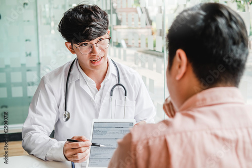 Doctors and patients consulting and diagnostic examining sit and talk. At the table near the window in the hospital medicine concept