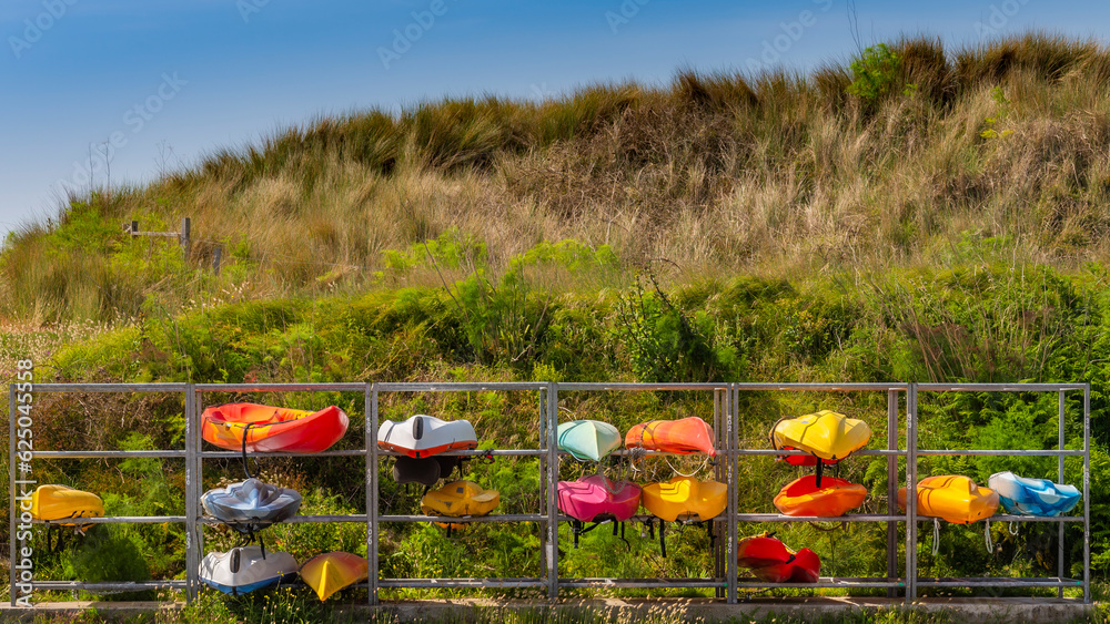 Parking for canoe. Storage and alignment of canoe at the foot of a sand