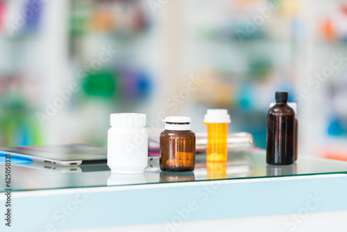 Drug and vitamin health care supplements on counter in drugstore.