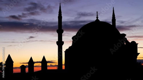 Nuruosmaniye Mosque, Time Lapse at Twilight with Colorful Clouds and Dark Silhouette of Ottoman Baroque style Mosque, Turkey photo