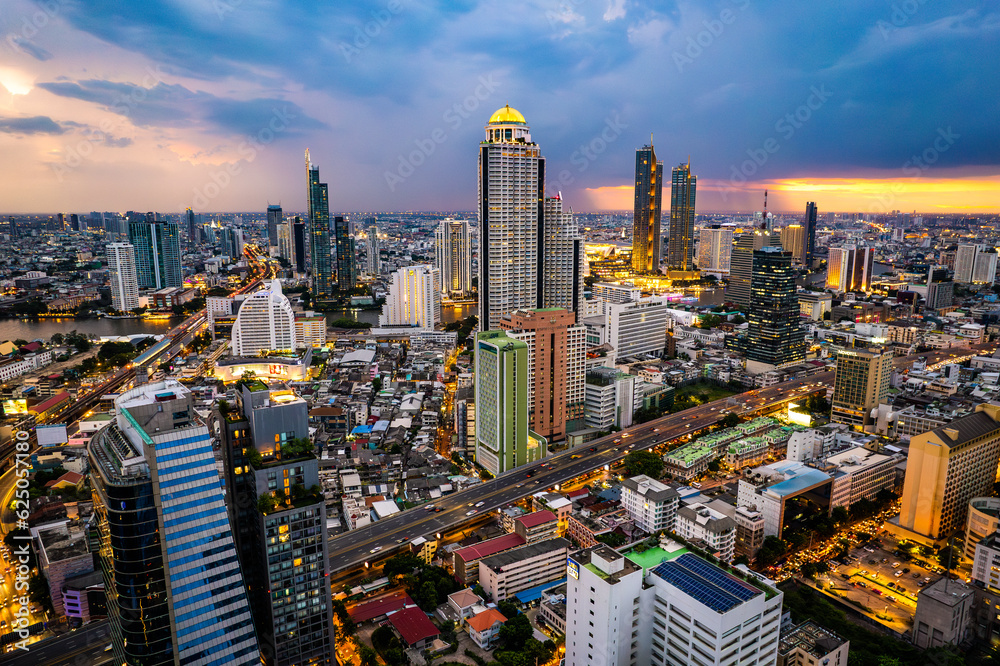 Fototapeta premium Aerial view of Sathorn and Saphan Taksin districts in Bangkok, Thailand