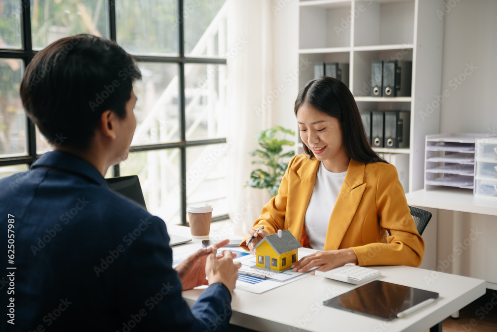 Signing a contract. Client and broker agent, lease agreement, successful deal and Young business sitting at the desk in office . Signing a contract. Client and broker agent, lease agreement, successful deal and Young business sitting at the desk in office .