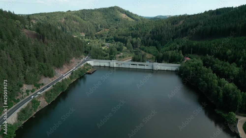 big river with a high dam view from above big river with a high dam view from above