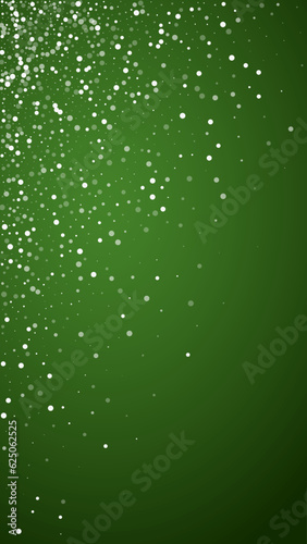 Beautiful snowfall christmas background. Subtle flying snow flakes and stars on christmas green background. Beautiful snowfall overlay template. Vertical vector illustration.