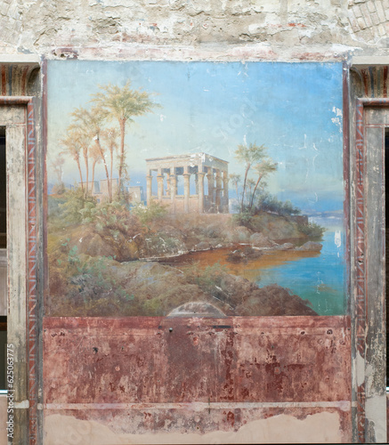 fresco depicting ancient Egyptian architecture on the Nile bank in the shade of date palms photo