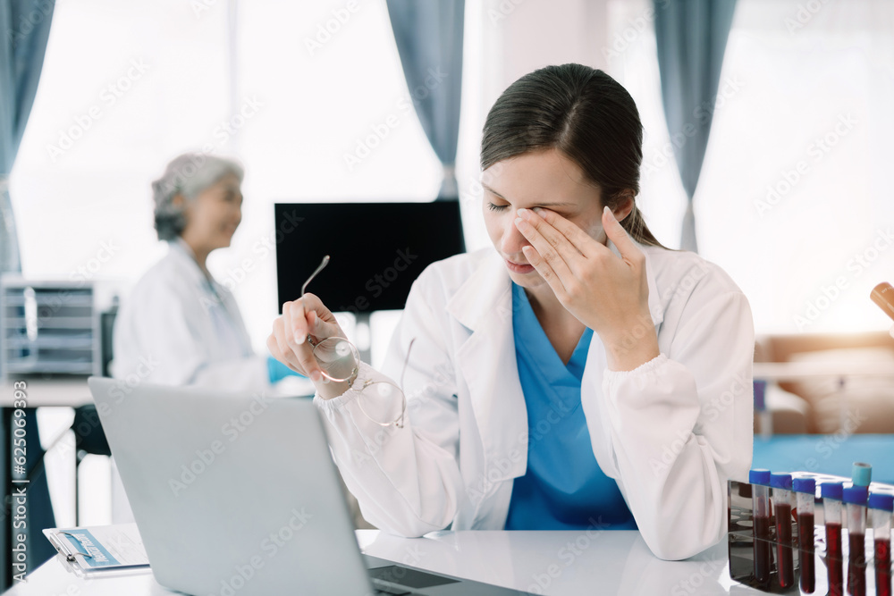 Female scientist are under stress from working in research lab. Female scientist are under stress from working in research lab.