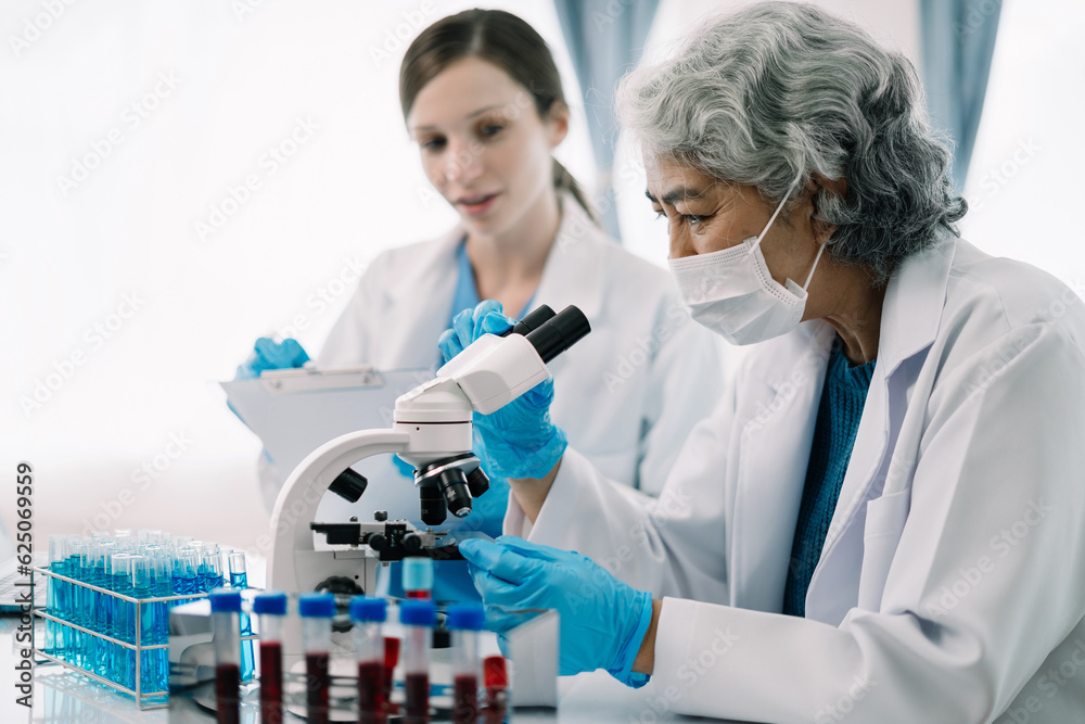 Scientist works with a pipette and a test tube. Scientific laboratory of biotechnology, development of medicine and research in chemistry, biochemistry and experiments. Scientist works with a pipette and a test tube. Scientific laboratory of biotechnology, development of medicine and research in chemistry, biochemistry and experiments.