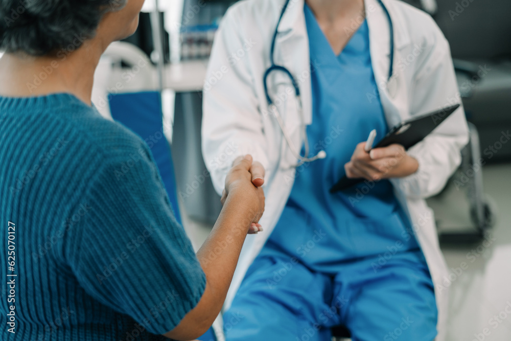 Female doctors shake hands with patients encouraging each other. To offer love, concern, and encouragement while checking the patient's health. concept of medicine. Female doctors shake hands with patients encouraging each other. To offer love, concern, and encouragement while checking the patient's health. concept of medicine.