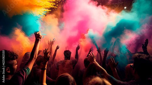  Crowd throwing bright coloured powder paint in the air. Happy holi indian festival celebration.