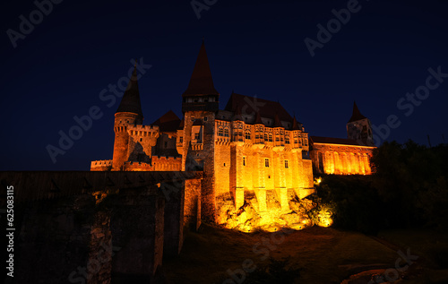 Corvin  Hunyad  Castle in Hunedoara during the evening. Wide angle night phoot with this amazing medieval castle landmark in Romania.