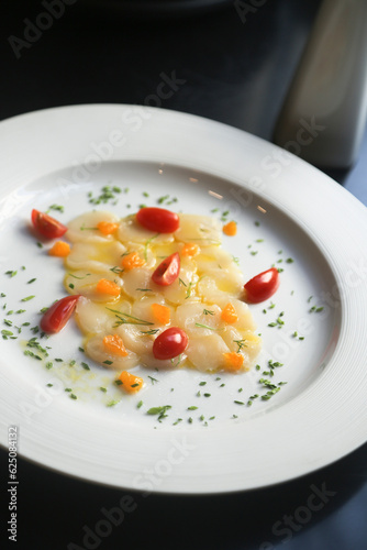 Scallop crudo with tomatoes and herbs