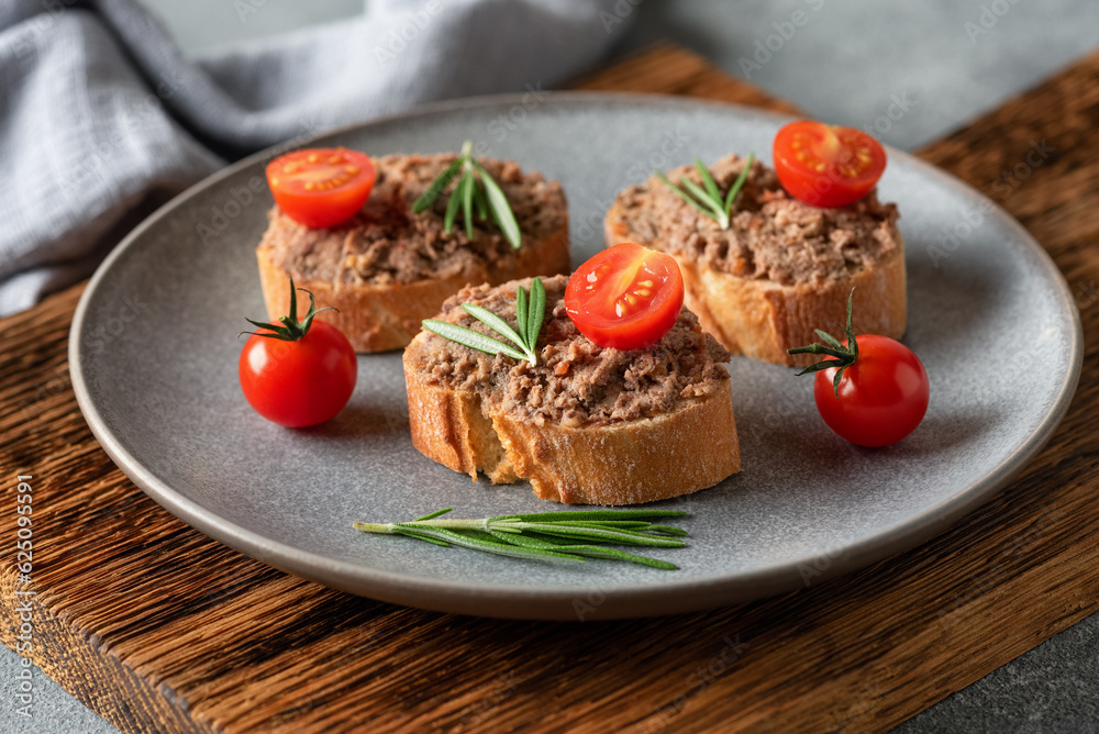 Toast with liver pate. Open sandwich with liver pate. Side view, selective focus. Toast with liver pate. Open sandwich with liver pate. Side view, selective focus.