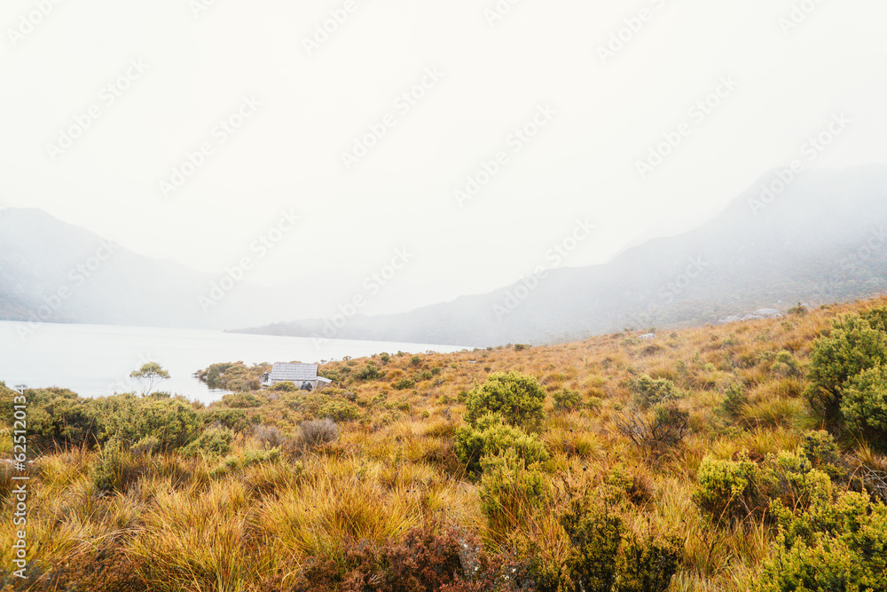 Exploring Dove Lake and Boatshed in Tasmania on misty day Exploring Dove Lake and Boatshed in Tasmania on misty day