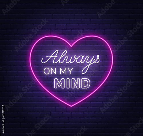 Always on my mind neon lettering on brick wall background.