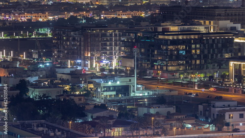 Aerial view to Dubai City Walk district night timelapse from above