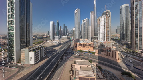 Aerial panoramic view of Dubai Downtown skyline with many towers timelapse.