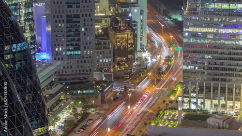Aerial view of traffic on Al Saada street in financial district night timelapse in Dubai, UAE.