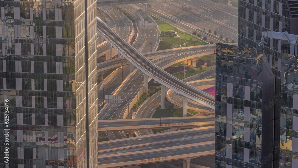 Aerial view from above to a busy road intersection in Dubai timelapse. Aerial view from above to a busy road intersection in Dubai timelapse.
