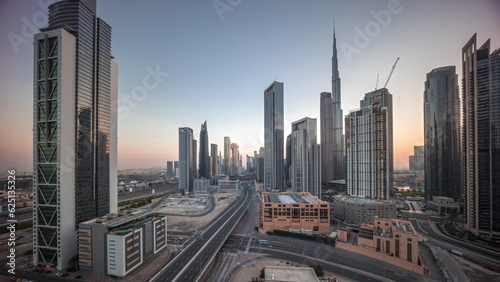 Aerial view of Dubai Downtown skyline during sunrise with many towers timelapse. © neiezhmakov