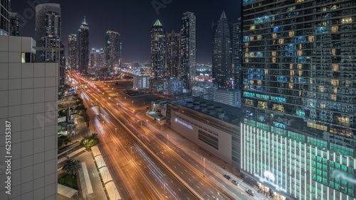 Panorama showing business bay district skyline with modern architecture night timelapse from above.