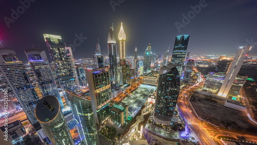 Skyline view of the high-rise buildings on Sheikh Zayed Road in Dubai aerial night timelapse, UAE.