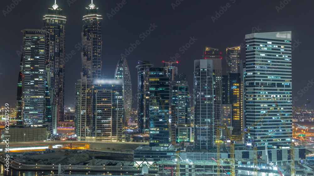 Cityscape with skyscrapers of Dubai Business Bay and water canal aerial night timelapse. Cityscape with skyscrapers of Dubai Business Bay and water canal aerial night timelapse.