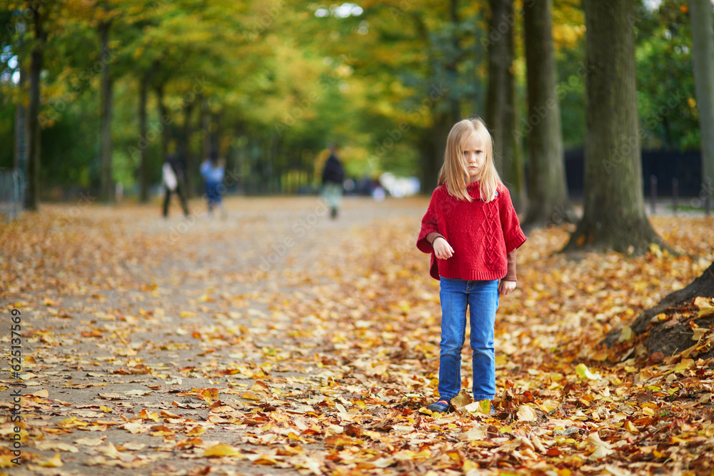 Moody preschooler girl at autumn day outdoors Moody preschooler girl at autumn day outdoors