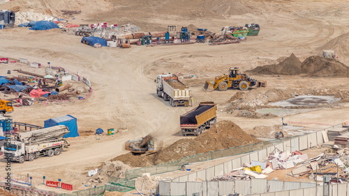 Foundation pit for construction of apartment complex building aerial timelapse in UAE