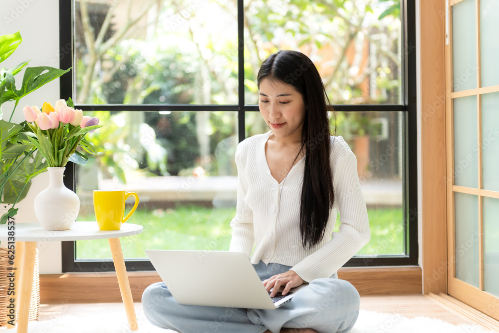 Happy young woman working and meeting online at home. Lifestyle freelance relax and chill drinking coffee in living room, Nature garden background. Lifestyle Concept Happy young woman working and meeting online at home. Lifestyle freelance relax and chill drinking coffee in living room, Nature garden background. Lifestyle Concept